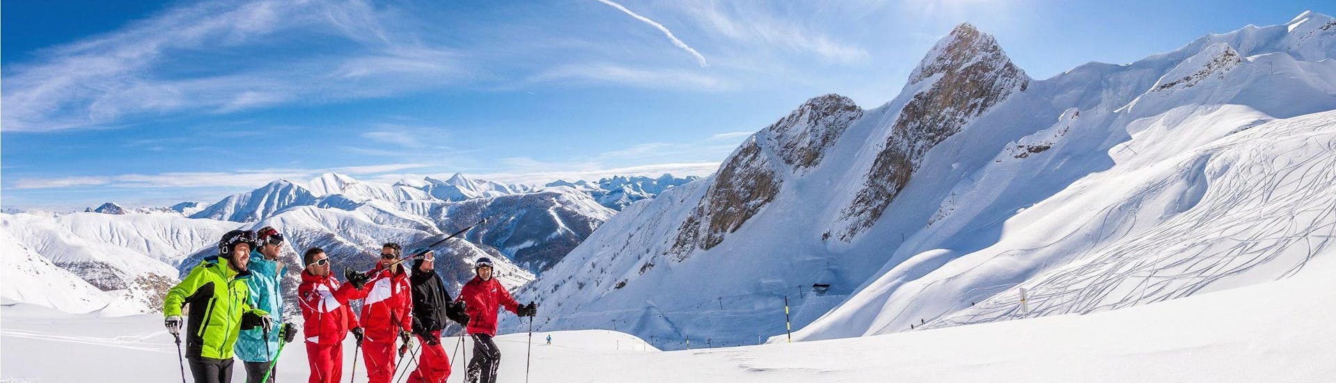 Skiers are at the top at the mountain, enjoying their Adult Ski Lessons for All Levels with the ski school ESF La Foux d'Allos.