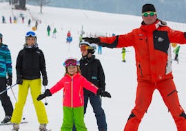 A child has lots of fun with their private skiing instructor from Skischule Zahmer Kaiser during a private ski lesson for kids of all levels.