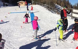 A group of kids at their Kids Ski Lessons (from 4 y.) for First Timers - Small Groups from Skischule Olympic Hugo Nindl Axamer Lizum.