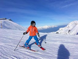 A young skier during his Private Ski Lessons for Kids of All Ages from Skischule Olympic Hugo Nindl Axamer Lizum.