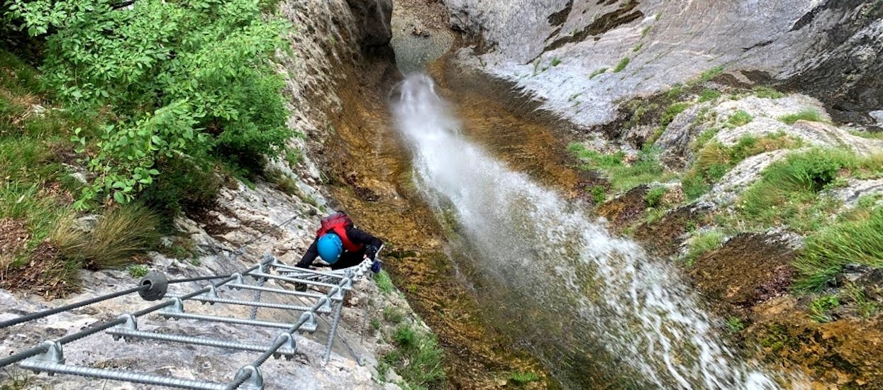 A man is hiking the Via Ferrata Cascata - Ballino with SKYclimber Tremosine.