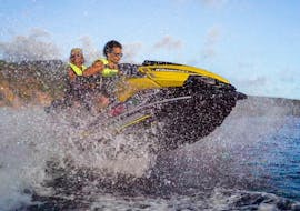A couple having fun on their jet ski during a jet ski outing in the Cousteau reserve with Iron Jet Bouillante.
