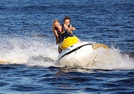 A couple is having fun while exploring the surroundings of Malta during a Jet Ski Safari to Comino & Blue Lagoon with Oh Yeah Malta. 