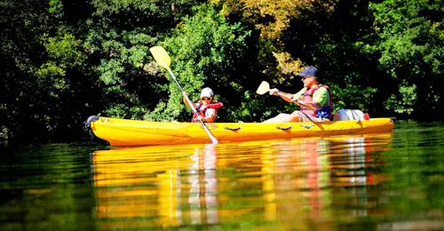 6km-canoe-hire-in-ardeche-mini-tour-viking-bateaux A young boy with his father on a 6km Canoe Hire in Ardèche - Mini-Tour provided by Viking Bateaux.