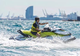 A woman rides a Sea Riders Badalona jet ski off the coast of Barcelona.