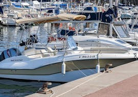 The Sea Riders Badalona boat is moored in the port of the Bay of Barcelona.