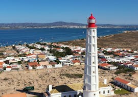 Beautiful Lighthouse in Olhão that you can see during the 3 Islands Boat Trip through the Ria Formosa Natural Park  with Odyssey Tours. 