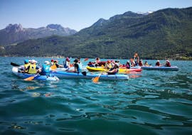 Group of people having fun kayaking during their Kayak Rental on Annecy Lake with Wake & Ski 74. 