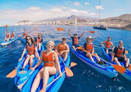 A group of people take a kayak tour near Los Cristianos beach in Tenerife with Diving Atlantis. 