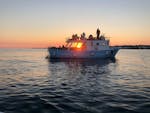 The stunning sunset that you can admire during the sunset boat trip to the Salento caves with Noleggio Nettuno Torre Vado.