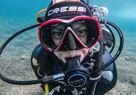 A diver looks at the camera while doing the PADI Scuba Diver course at Los Cristianos beach with Diving Atlantis. 