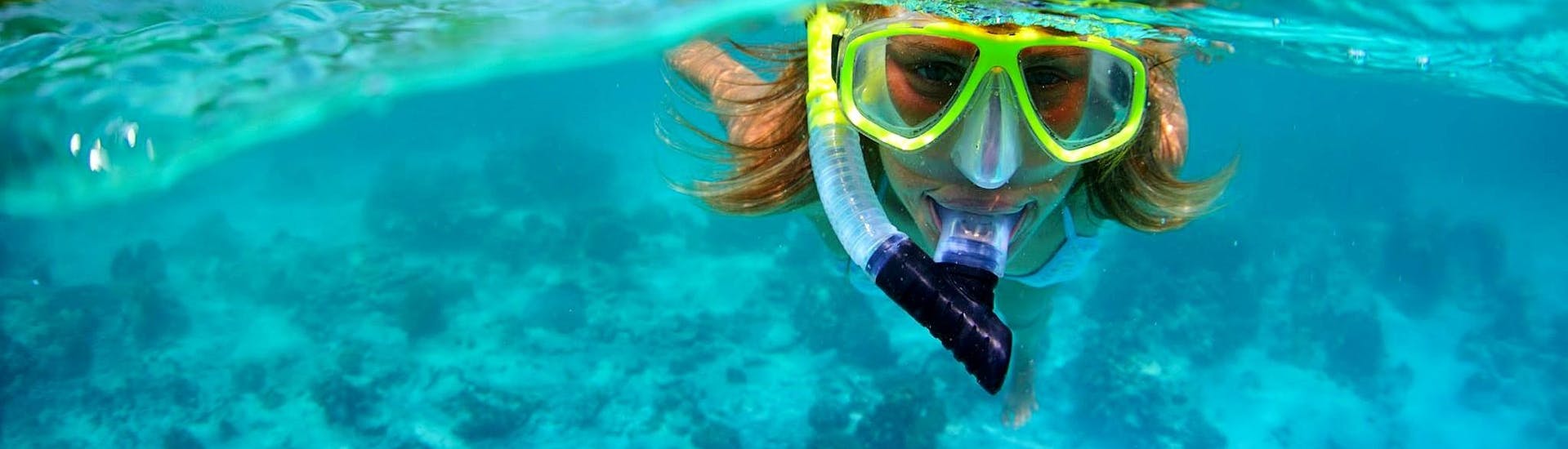 Picture of a kid snorkeling during the Boat Trip to Murenario di Sant'Irene from Tropea.