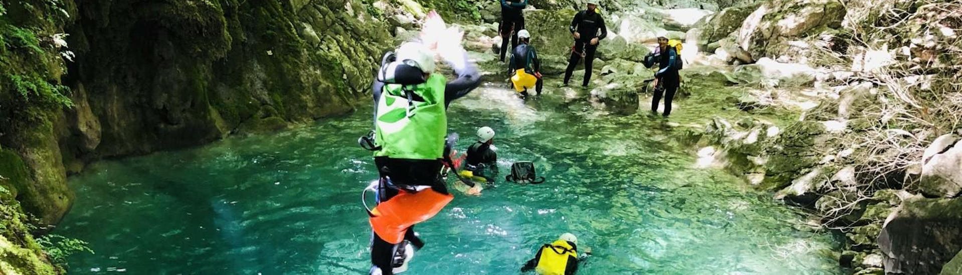 A  man is jumping in Carleva Canyon during a full day canyoning with Maglia Canyoning.