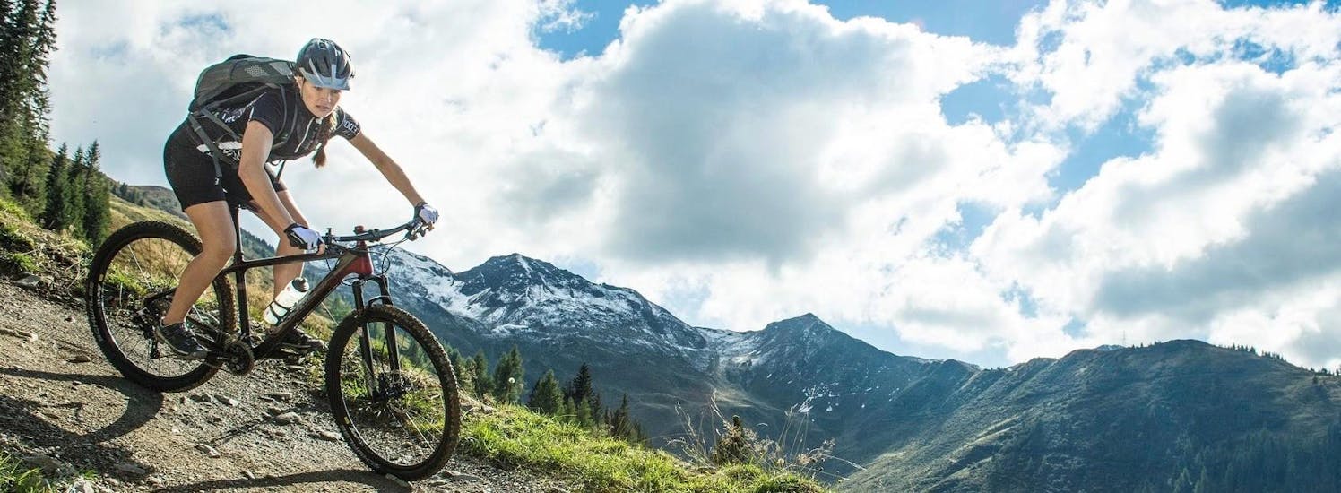 Man biking during the Mountain Bike Hire in Cran Montana with Intersport Zermatten.