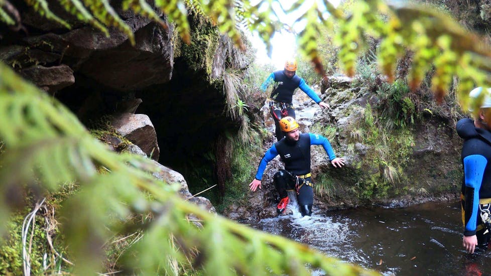 Men canyoning in Ribeiro Frio with Madeira Adventure Kingdom.