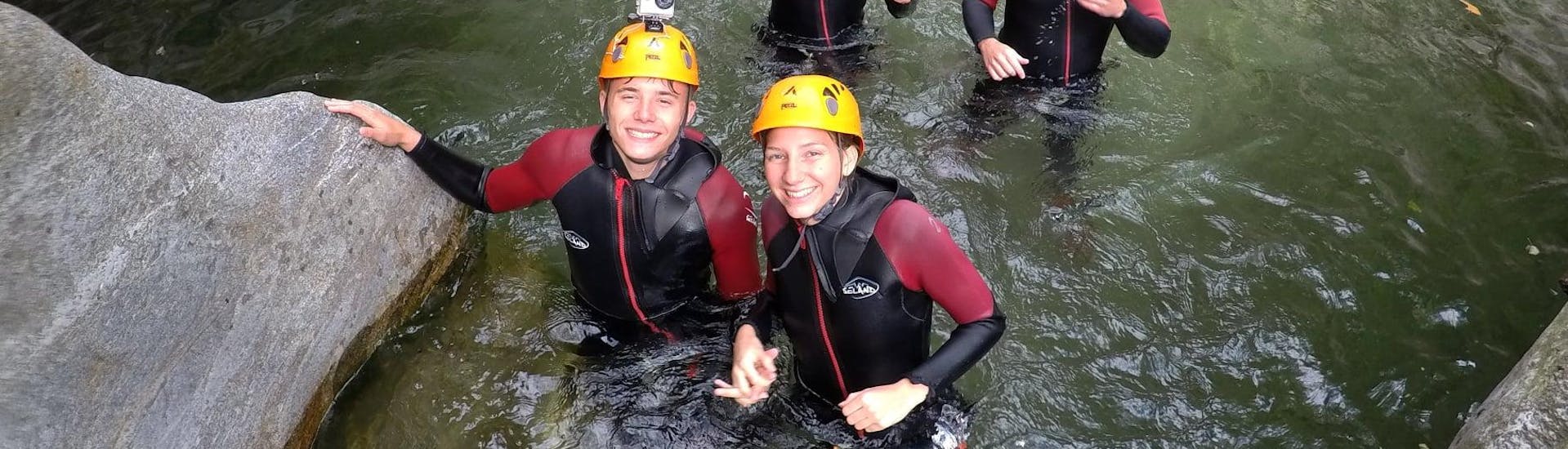 A family having fun while Canyoning in the Corippo Canyon with Ticino Adventures.