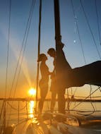 A couple is enjoying the sunset during their Romantic Sunset Sailing Trip on Lake Constance with MB Events & Adventures.