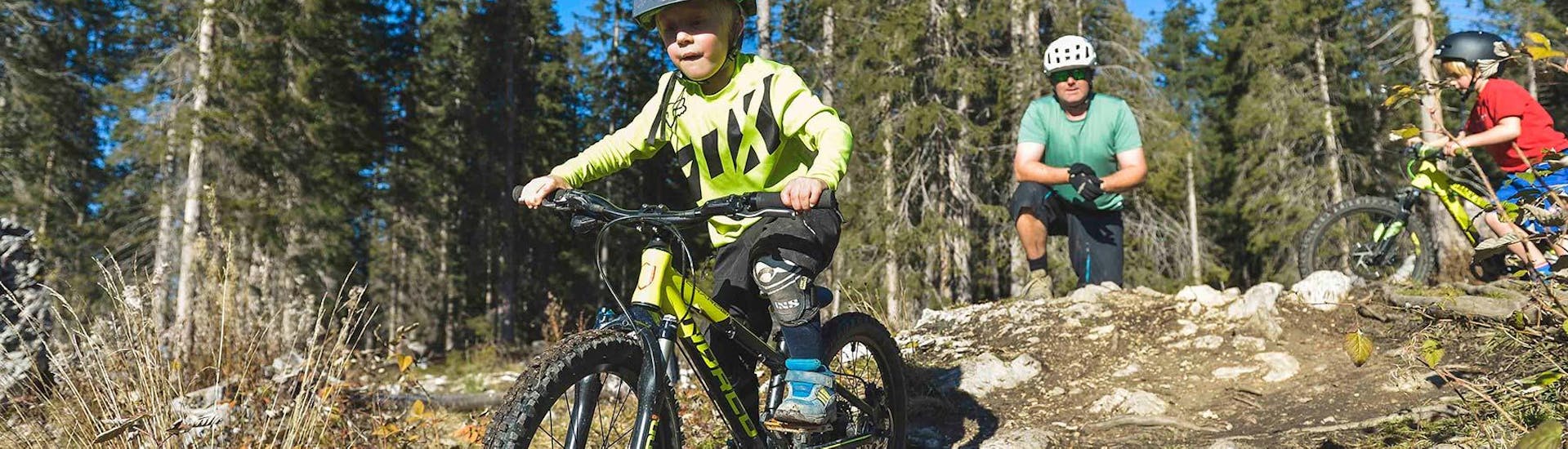 A child riding a bike during the Mountain Bike Hire for Kids in Lenzerheide with Epic Lenzerheide.