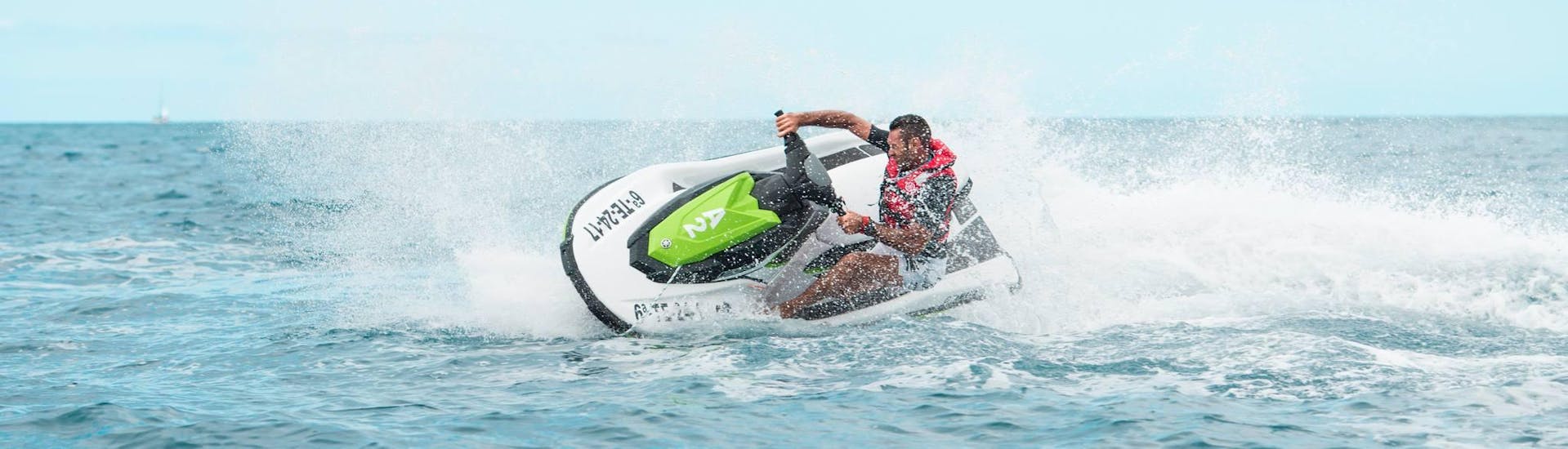 A man rides a jet ski in Costa Adeje with Watersports Tenerife.