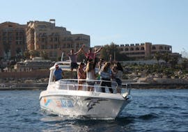 A group of people enjoy a boat trip in a self drive boat from Sun and Fun Watersports Malta. 