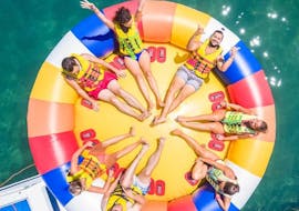 A group of friends go on an inflatable ride in Daphnila Beach with Corfu Ski Club.