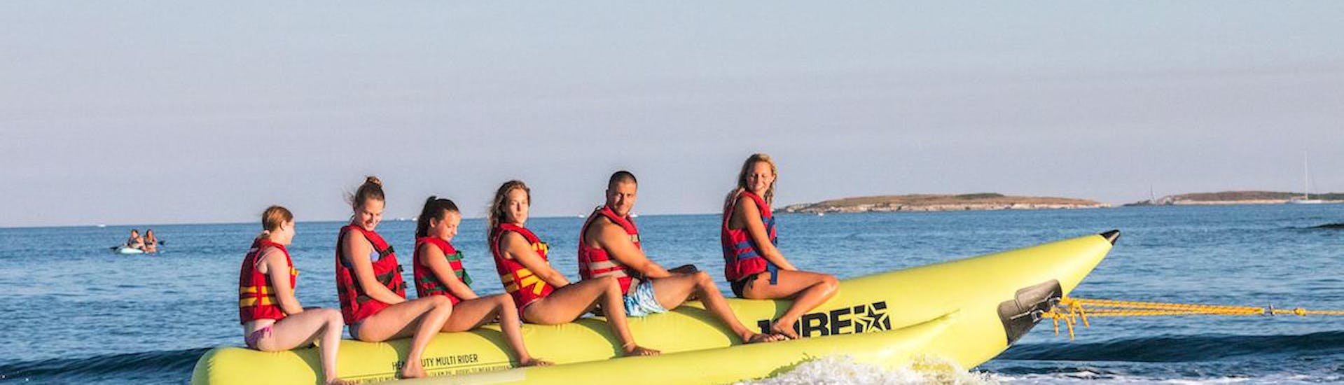 A group of friends on a banana boat ride at Cape Kamenjak with Prementura Watersports. 