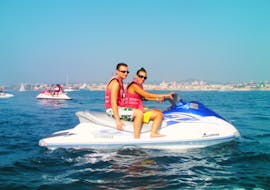 Couple doing a Mini Jet Ski Safari in the Baie des Anges in Nice with Jet Evasion.