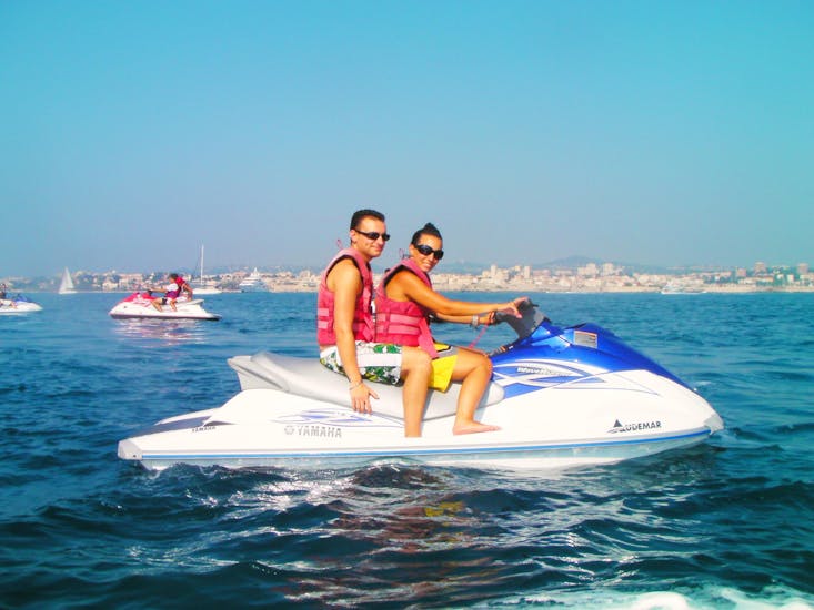 A couple during a jet ski safari from Nice to Villefranche-sur-Mer.