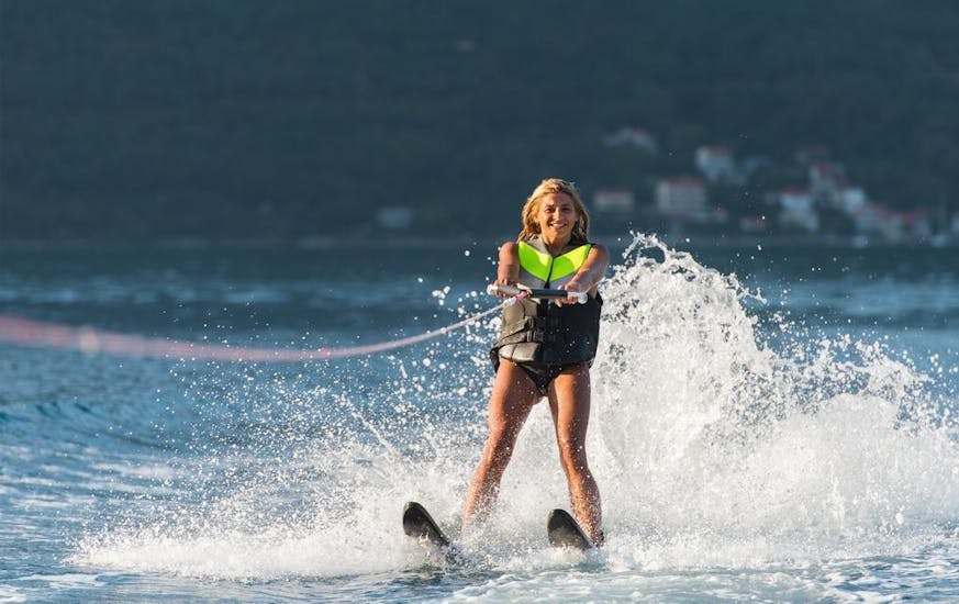 A girl goes waterskiing on Rethymno Beach with Popeye Watersports. 