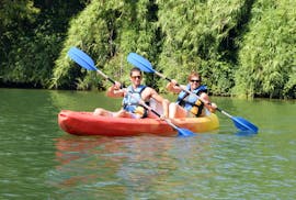 A couple is paddling in their Kayak & Canoe on the Argens River to Saint-Aygulf Beach with Kayak Paddle Fréjus.