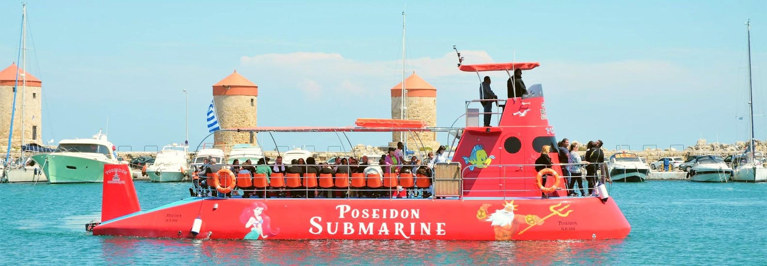 The semi-submarine of Poseidon Submarine Rhodes is leaving Mandraki Port.
