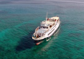 A boat is heading towards the island during the Boat Trip to Chrissi Island from Ierapetra with Cretan Daily Cruises.