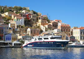 Symi Island Cruise to Symi Town & Panormitis Monastery with Manos Going Rhodes The Manos Going Rhodes boat mooring at Symi Town during the Symi Island Cruise to Symi Town & Panormitis Monastery.