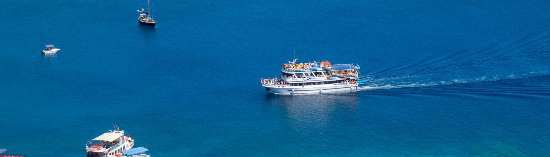 The boat is reaching Lindos during the Cruise to Lindos with Swimming Stop in Anthony Quinn’s Bay with Manos Going Rhodes.