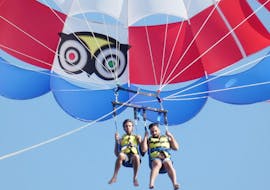 Two happy people enjoying the parasailing in Costa Adeje with Parascending Tenerife.