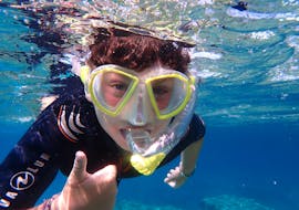 A young boy during his Snorkeling Trip to Cala Delta Nature Reserve from El Arenal with Diving and Adventure Mallorca.