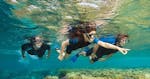A group of children is exploring the Mediterranean seabed while Snorkeling near Cannes with the Dive Centre La Rague.