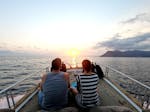 Two people enjoying the sunset boat trip from Levanto to Cinque Terre with Costa di Faraggiana Levanto.