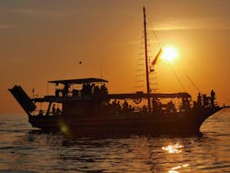Gita in barca al tramonto attorno a Poreč con osservazione dei delfini con Kristofor Boat Excursions Poreč.