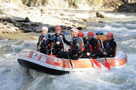 A group is white water rafting on the Noguera Pallaresa river for beginners with Rafting Llavorsí.