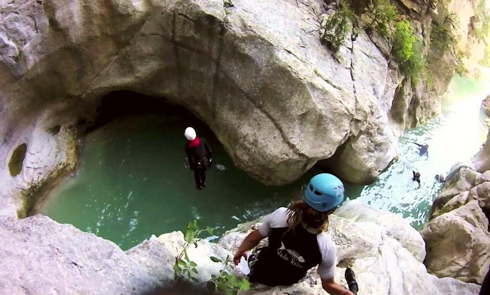Person jumping during Discovery Canyoning in the Gours du Ray Canyon with Feel Rafting. 