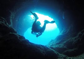 A person doing a Guided Dive at the Elephant's Cave in Chania with Omega Divers.