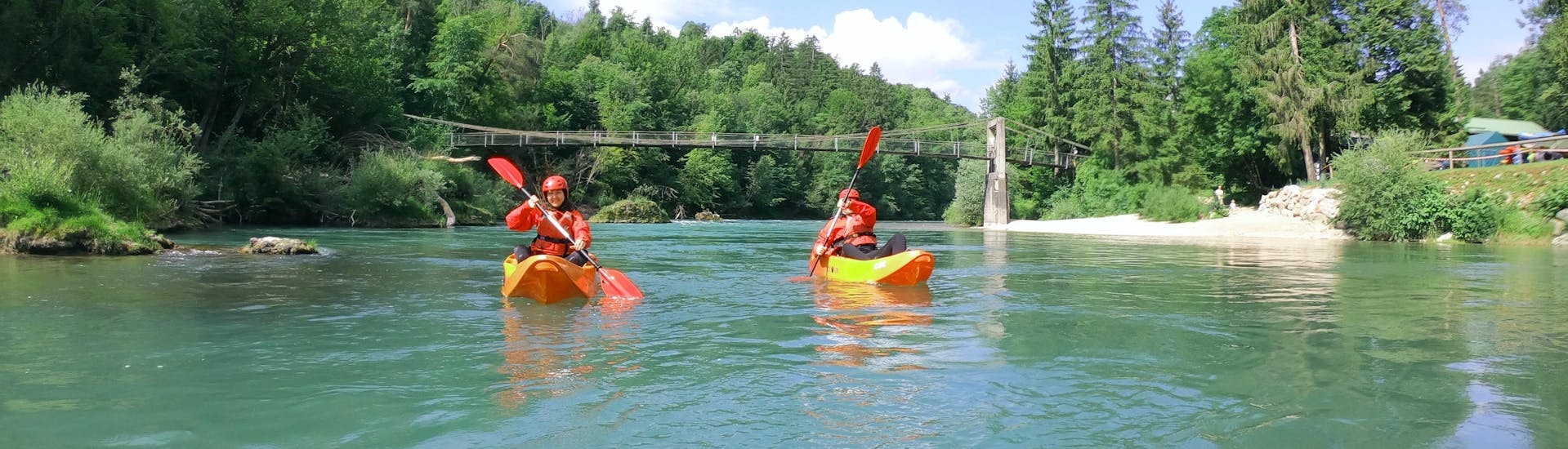 2 friends enjoying a 9 km Kayaking on the Dolinka River from Bled with Outdoor Slovenia Bled.