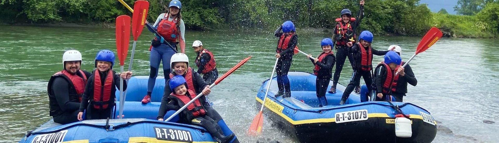 A rafting group is having fun on two boats during their Soft Rafting on the Ziller River with Freiluftakademie Zillertal.