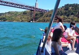 People are doing a private catamaran tour with boat me up on the Tagus River in Lisbon.