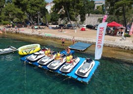 An image of the jet skis from Rent a Jet Ski Kolovare Beach lined up along the beach in Zadar.