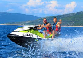 jet-ski-safari-to-voscice-from-rakalj-istria-adventure Two people having fun during their Jet Ski Safari to Vošćice from Rakalj with Istria Adventure.