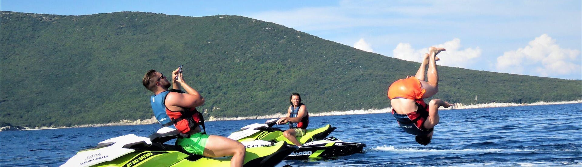 Friends have fun while doing a Jet Ski Safari to the Blue Cave from Rakalj with Istria Adventure.