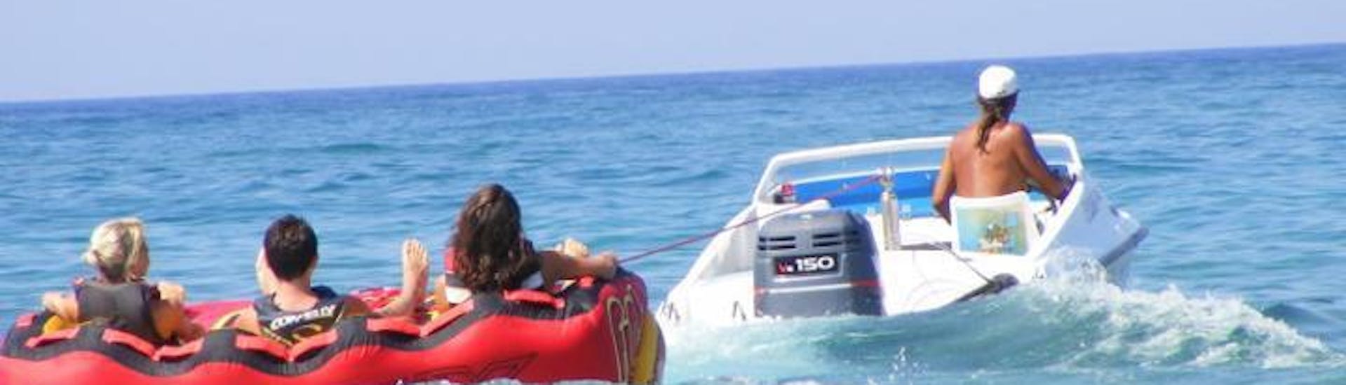 People doing a Banana Boat Ride and More Towable Tubes in Stalida in Crete with SlalomWater Sports.