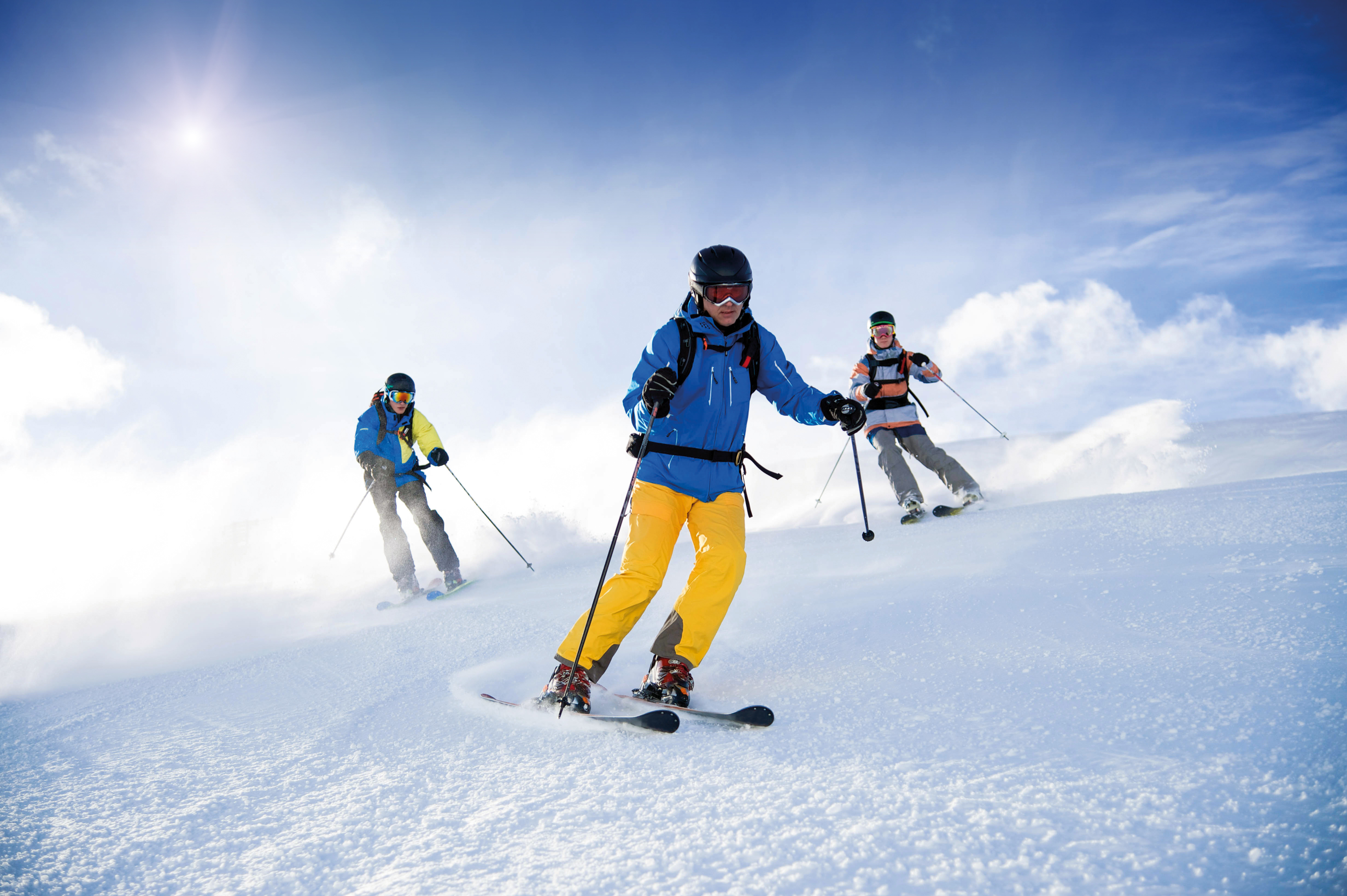 During the Adult Ski Lessons for Advanced Skiers with Family Ski School GO! Bad Gastein, a ski instructor and his two students are skiing down a slope.